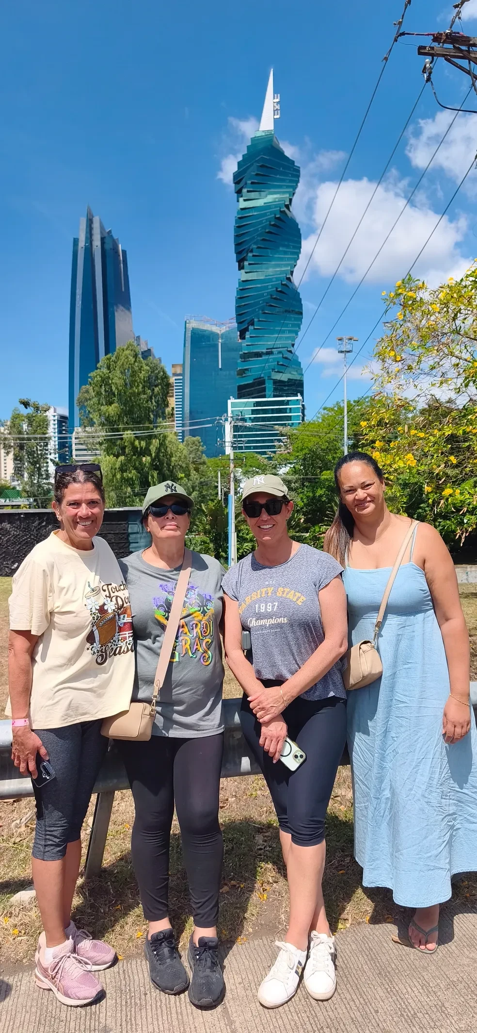 Tour group posing in front of Panama City skyscrapers